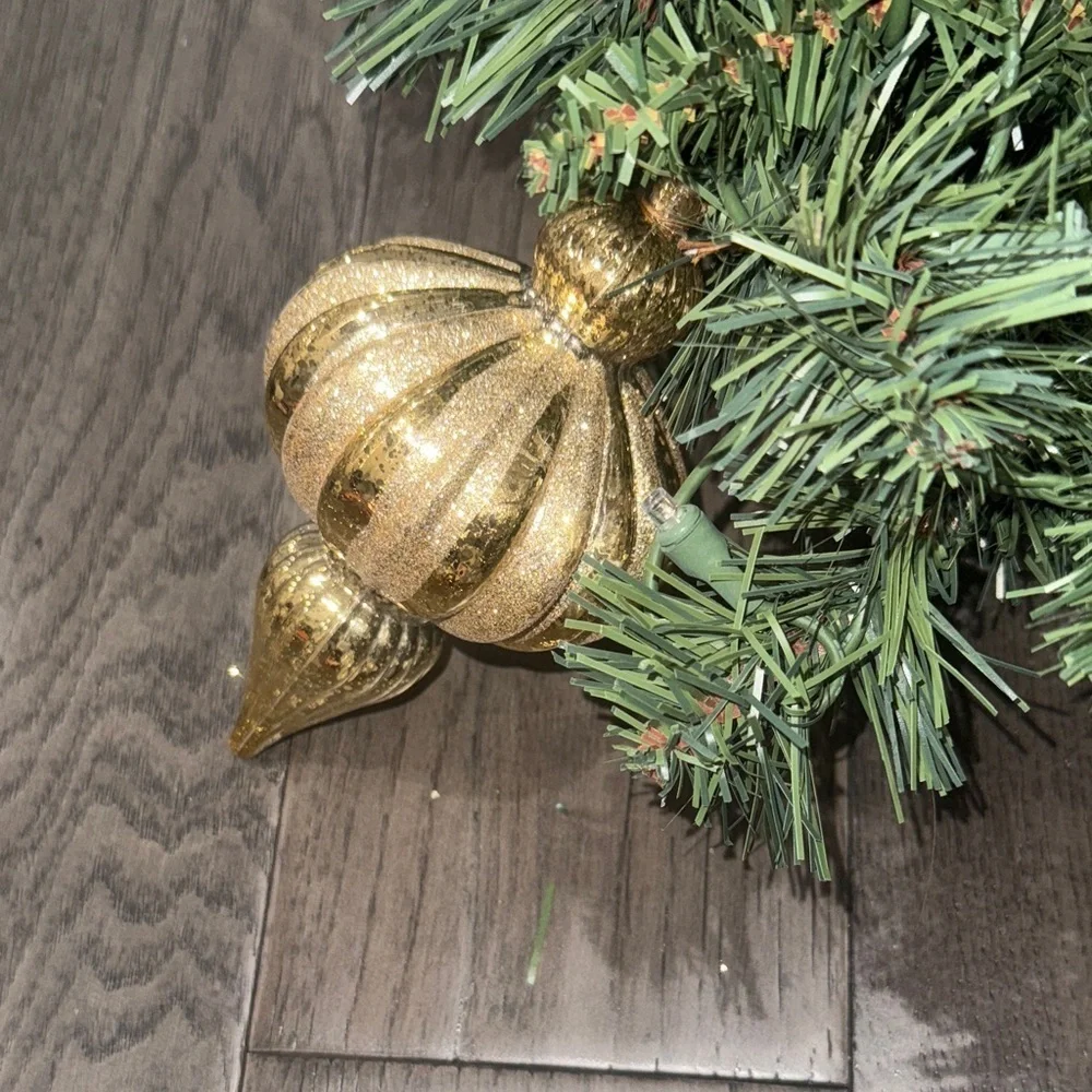 Festive Green Holiday Garland with Gold Accents and lights